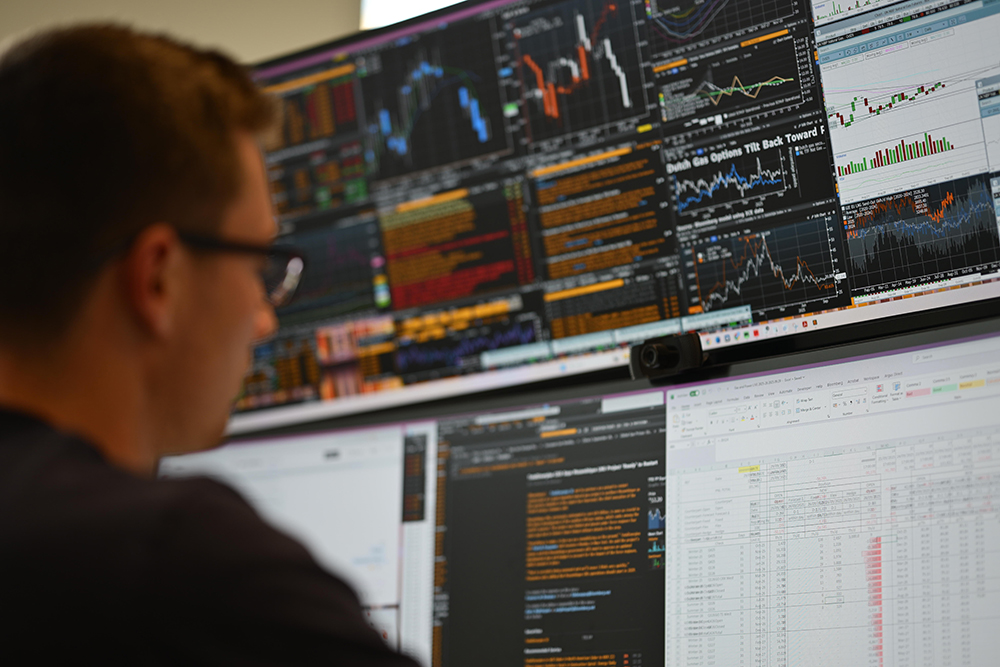 A person looks at energy data on a screen.