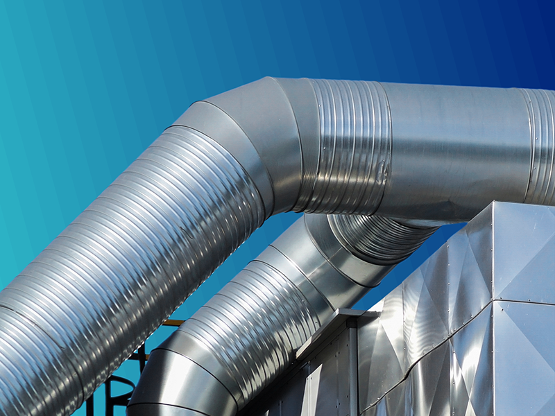 Multiple large, shiny metal ventilation pipes against a turquoise gradient background.