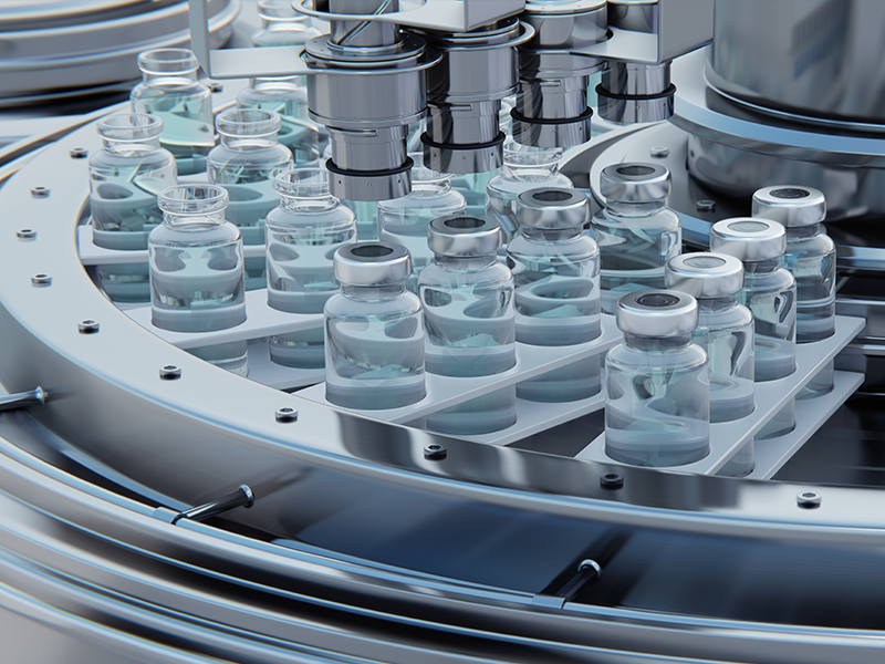 Glass bottles full of clear liquid with metal lids move through a circular production line.