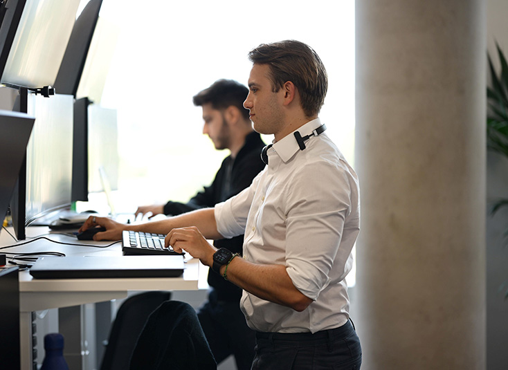A person looks at energy data on a screen.